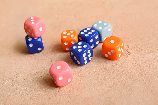 Different dices on beige background