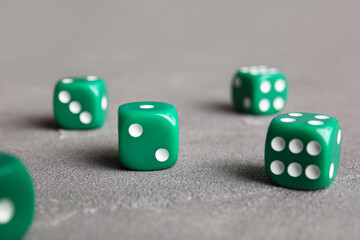 Green dices on grey background