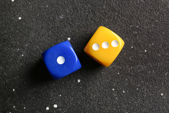 Different dices on dark background