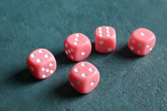 Pink dices on color background