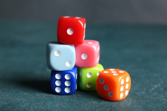 Different dices on color background