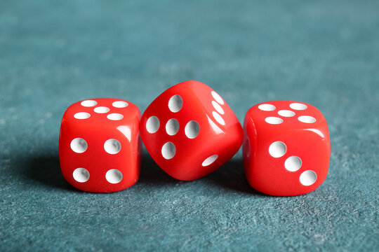 Red dices on color background