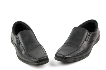 two elegant black leather business slip-on shoes placed on a clean white background, showcasing their design and style suitable for formal occasions.