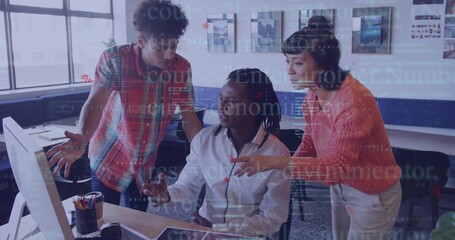 Collaborating three software engineers typing code on monitor in modern workspace, with coffee mug