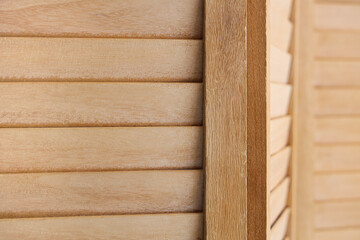 Texture of wooden folding screen as background, closeup