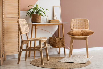 Interior of room with wicker chairs and table