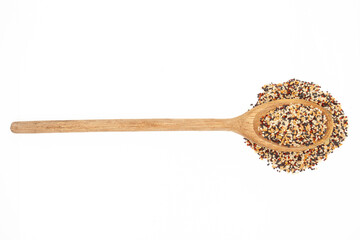 Rustic wooden spoon with tricolor quinoa on white background