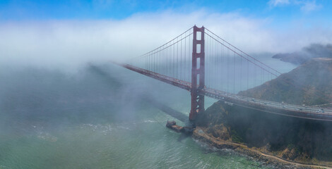 Golden Gate Bridge north tower in the fog at San Francisco Bay, city of San Francisco, California CA, USA. 