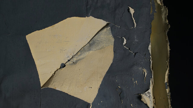 Wall with peeling and damaged black paint surface - Powered by Adobe