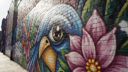 Colorful urban mural on brick wall with parrot and tropical flower art - Powered by Adobe
