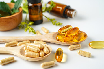Alternative medicine herbal organic capsule vitamin E omega 3 fish oil drug herbs leaf natural