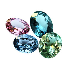 Fototapeta premium Four oval gems in pink, blue, and green, cut and faceted