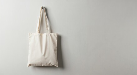Canvas Bag on wall: The eco-friendly tote bag, a blank canvas of sustainable living, hangs casually, ready to carry your values.