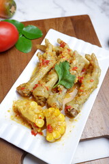 a plate of Spicy food, ceker mercon. Selective focus. Chicken feet with spicy chili sauce or ceker mercon. Ceker pedas or spicy chicken feet. Indonesian street food made from chicken feet, chili, 