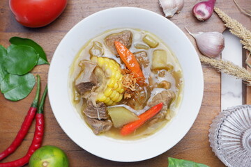 Tamarind Beans Beef Soup or Sayur Asem Asem Daging Sapi, a fresh and healthy homemade dish made from chickpeas, beef, red green chilies, and tomatoes. It's savory, spicy, salty, sweet and sour