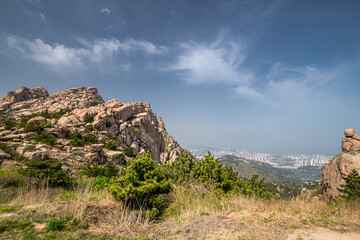 Beautiful rock formation against the blue sky in Dazhu Mountain Scenic Area in Qingdao Shandong Province, China