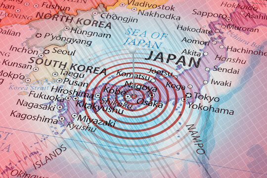A needle into japan political map with an earth waves and a seismograph lines in an eartquake composition