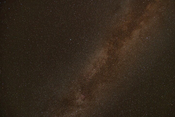 Wide view of Milky Way galaxy shining with stars in clear dark atmosphere.