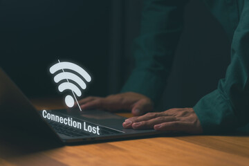Close-up of person using laptop with Wi-Fi icon and Connection Lost, symbolizing internet disconnection or network failure. Concept for online issues, connectivity problems, or system downtime.