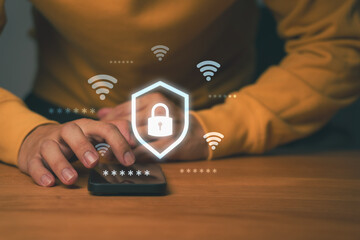 Close-up of hands using smartphone with glowing padlock and Wi-Fi icons, symbolizing secure...