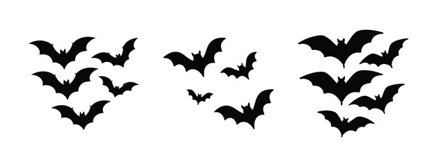 Fototapeta premium Three silhouetted bat swarms flying together in a cluster for halloween or spooky themed designs