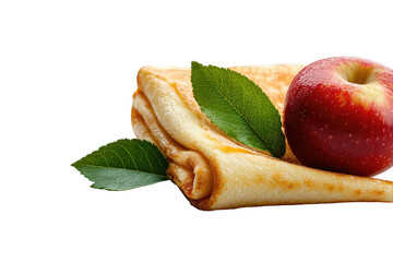 Folded pancake topped with red apple and green leaves