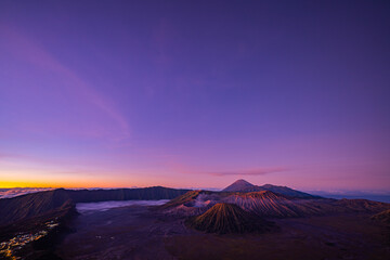 Aerial view colorful sky at twilight above the horizon.Amazing View from the top of the mountain Pennajagan view point to see Bromo volcanoes. Destination of tourists coming to Indonesia.