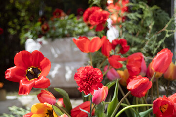 The flowers adorn the military memorial, resting upon a marble slab, serving as a testament to the...