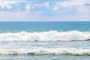 Waves turquoise blue water and sand at tropical beach Thailand.