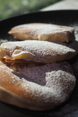 Delicious pancakes served with powdered sugar topping