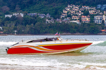 Obraz premium Speed boat yacht boats turquoise blue water Patong Beach Thailand.