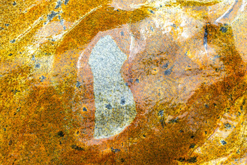 Wet yellow orange rock stone texture in Patong Phuket Thailand.