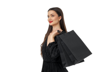 Woman smiles joyfully with black shopping bags, isolated, PNG