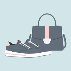Stylish grey sneaker and matching handbag fashion accessory set.