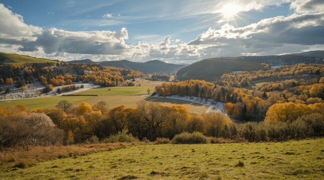 Autumn landscape scenic view with rolling hills trees and lake under cloudy sky