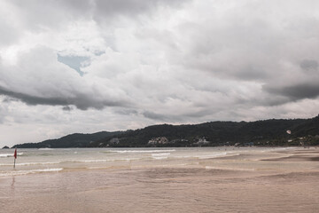Patong Beach Phuket with turquoise blue water white sand Thailand.