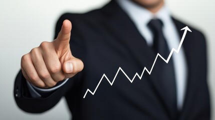 A business professional points upward, symbolizing growth and success, with a rising graph in the background.