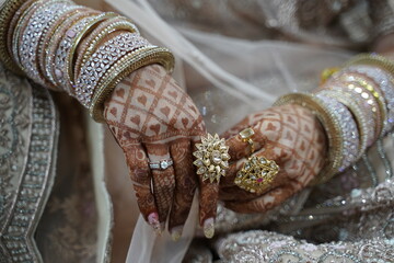 Indian bride's hands decorated with mehndi