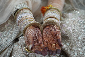 Indian bride's hands decorated with mehndi