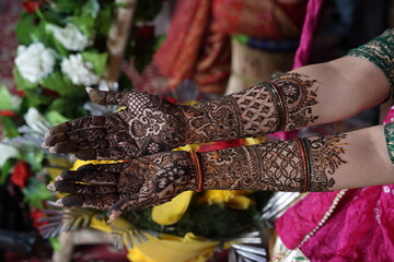 Indian bride's hands decorated with mehndi