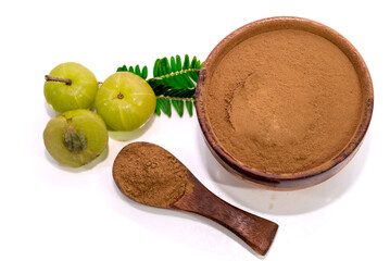 Flat lay of Amla (Indian gooseberry) powder with fresh fruits isolated on white background. Herbal