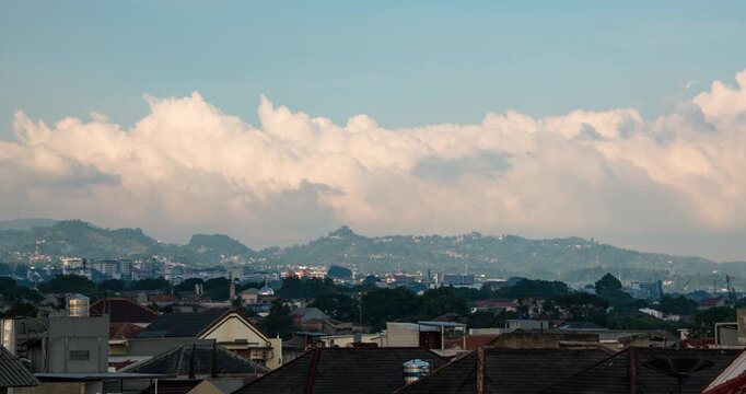 Timelapse of thick clouds rolling over the hills in Bandung, Indonesia
