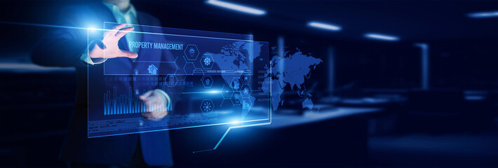 Manager pointing property management platform, which analyzes tenant data, maintenance schedules, rent collection, financial reports, and operational efficiency.