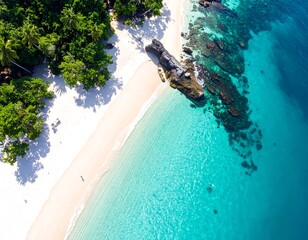 Aerial view of a pristine tropical beach with clear turquoise water and lush greenery