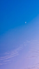 Capture the serene beauty of a crescent moon in a tranquil gradient sky, perfect for adding a calming touch to your next project or design aesthetic.