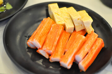 Japanese omelete, japanese omelette or sweet egg or sweetened egg or tamagoyaki or Japanese rolled omelette and imitation crab or crab stick