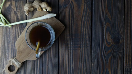 ginger and lemongrass for drink on wooden table. Top view. Copy space