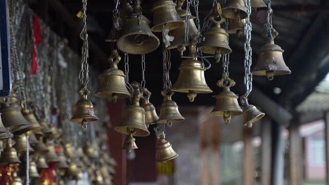 There are many bells inside the temple.