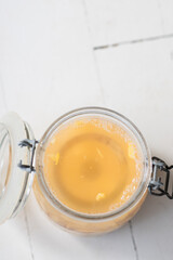 a glass weight in a jar of saurkraut keeps the cabbage beneath the water line