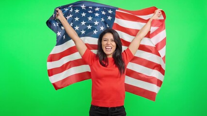 Patriotic american woman waving a United States flag on green screen